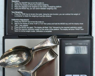 Lot 212: Cooper Brothers Sheffield Sterling silverware set baby spoon and pusher(40 grams) in red presentation box