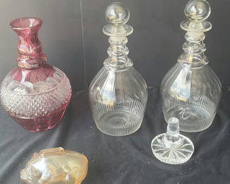 Lot 53: Glass decanter collection with pig figurine