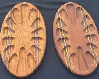 Lot 4: Pair of oval wooden boards with multiple recessed slots and decorative inlays