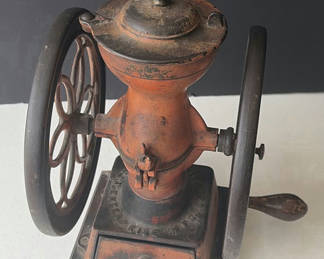 Lot 65: Antique hand-crank coffee grinder with dual wheels