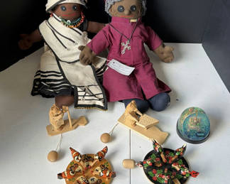 Lot 220: Cloth dolls, wooden folk-art figures, and a glitter globe