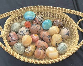 Lot 10: Hand woven basket from South Carolina filled with hand painted stone eggs