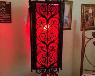 Mid-Century, Spanish Revival swag light with lucite red interior and scroll work panel details. 