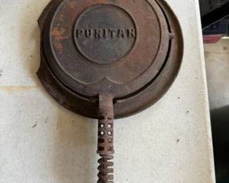 Puritan No. 8 Cast Iron Waffle Iron with an 885 pattern number indcates this was made by Griswold according to my AI buddy.