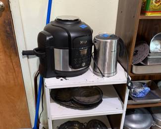 This metal cart is in the laundry room, small appliances, Ninja, vintage silver plate
