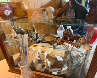 This showcase contains, Alabaster items, pocket knives, ceramics, perfume bottles and so much more!