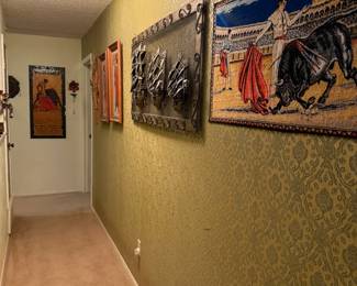 Looking down the hallway with great metal, textile and textured prints