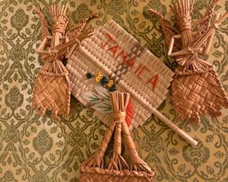 A collection of straw art pieces