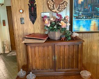 MC solide wood cupboard, great condition, with original hardware. Belowe is an oak coffee table with drawer, also in great conditon. Florals and vintage scrip books