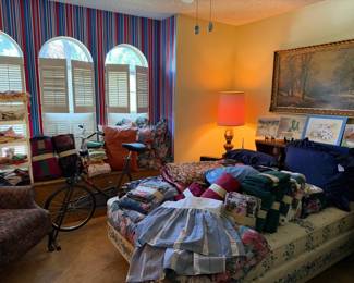 The guest room, lots of really nice beding, throws, blankets, vintage table linens