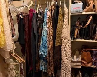 Looking into the master closet, scarves wraps, purses, hats
