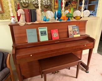 Baldwin upright piano with sheet music storage bench. The owner of this piano was a classical pianist and music teacher.