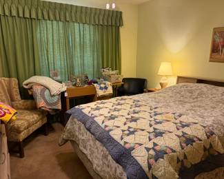 Looking across the bedroom, wonderful vintage handmade quilts