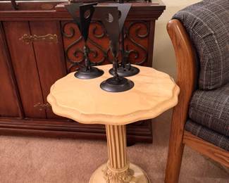 A close look at the marble style table with great columb and base details