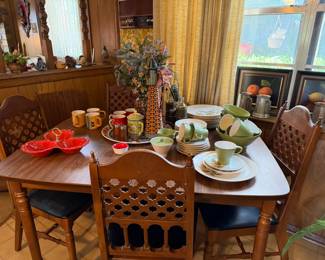 In the kitchen dining area, vintage table with one leaf and four chairs, vintage ceramics 