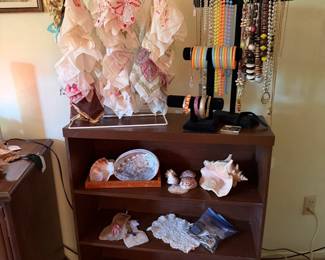 Vintage bookcase, shells, vintage hankies and vintage jewelry