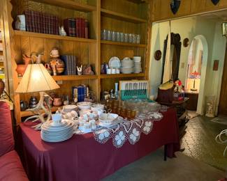 Looking across the living room, book shelves and table full of great items
