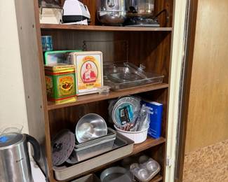Small appliances, tall bookcase, baking items