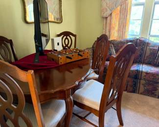 Vintage dining table with six chairs, two with arms and one leaf, great condition