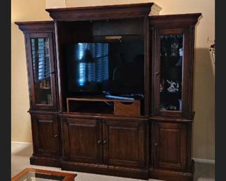 Entertainment center $125. Dimensions- side pieces 17 3/4 inches deep 18 1/4 inches wide 70 1/4 inches tall. Middle piece- 24 inches deep 42 1/2 inches wide 70 1/4 inches tall