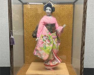 Vintage Japanese doll in glass case