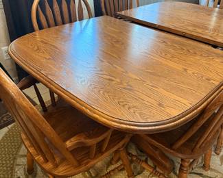 Dinning room table and chairs (includes extra panels inside) 6 chairs and two bar stool chairs. Solid maple