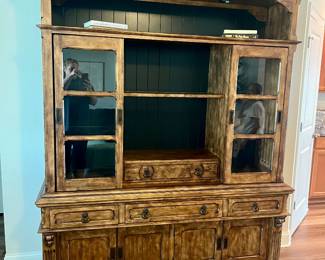 Isn't this a fantastic piece you won't have to do anything to! Black ship lap backing and glass doors with nice top shelf and bottom storage cabinet. 