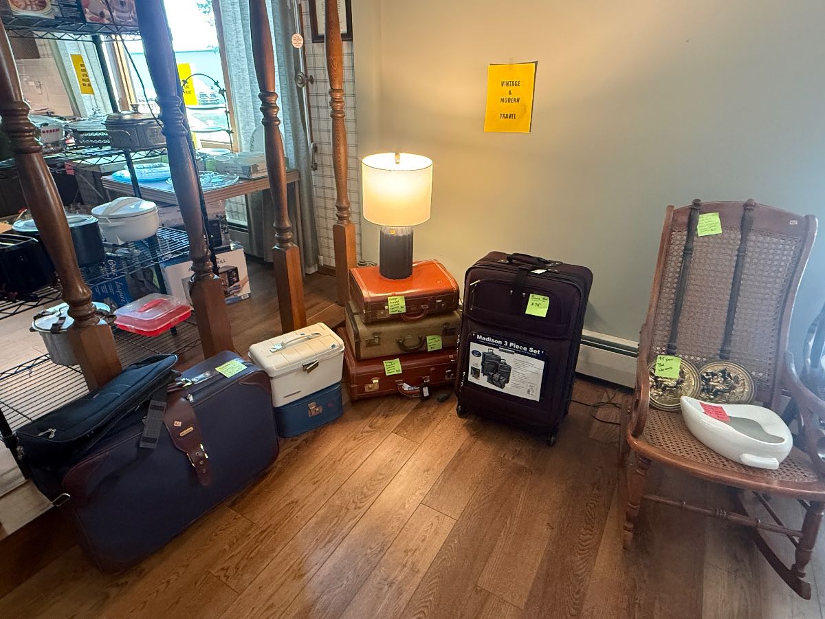 Vintage suitcases in excellent condition. Great decorative feature. Also brand new 3-piece suitcase set. Never used - tags still on!