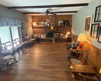 Picture gallery, plus antique cane chairs, end tables and lamps.
