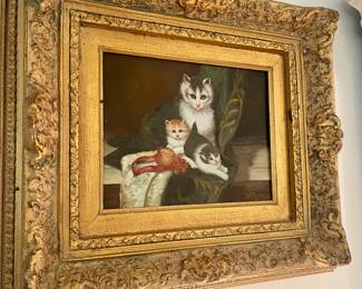 Cute cat painting in ornate frame