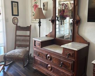 Dresser with drop center vanity. Eastlake sub style characteristics.