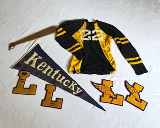 1920s collegiate pieces, including a football jersey, pennant, letters, and even a fraternity paddle