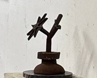 Brutalist steel sculpture.