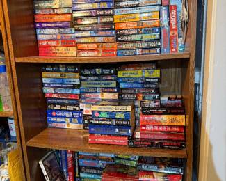 Paperbacks, tons of Clive Cussler