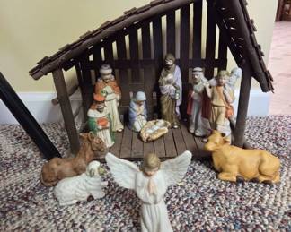 Nativity Scene Featuring Figurines and Stable