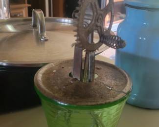Antique hand mixer with uranium glass base
