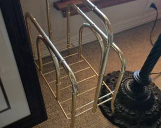 A Hollywood Regency faux bamboo brass magazine rack.