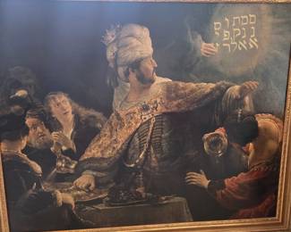 Decorative print of Rembrandt's "Belshazzar's Feast" in an ornate frame