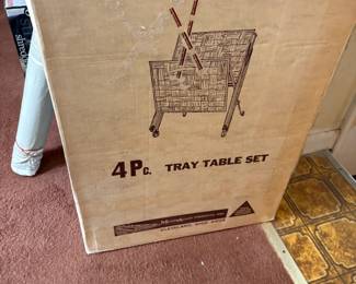 . . . old new-in-box -- never opened -- TV trays