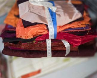  contains varied scraps of 100% pure silk, likely remnants from vintage saris.The set features mixed colors and textures, suitable for diverse craft projects like nuno felting, textile art, or jewelry making.