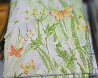 vintage Bibb Company bedding set, often referred to as the "Spring Meadow" pattern, featuring yellow and orange butterflies on a white background with green foliage.