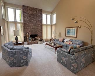 Sectional couch; end tables; coffee table; three arm, brass floor lamp