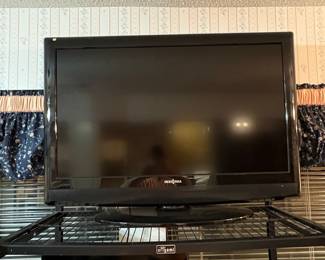 Insignia Flat Screen LED TV on Origami Folding Storage Rack