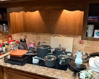 Large Selection of Kitchen items including Cookware Dishes and Flatware/Silverware.