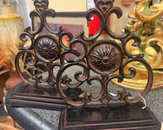 Cast Iron bookends  featuring brown finish and distinctive floral medallion center 