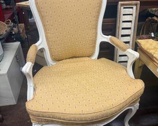 Louis XV French Provincial  arm chairs with flower detail on back and yellow patterned upholstery 