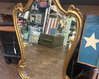 Vintage Italian or French  gilt wood mirror with highly ornate, gilded frame 