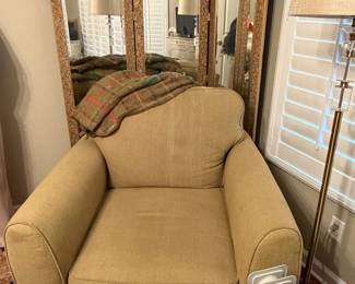 Mirrored room divider, upholstered sitting chair