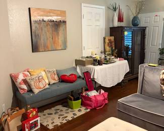 Upholstered bench, accent pillows, canvas art
