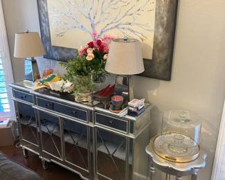 Mirrored credenza, table lamps, decor, canvas art